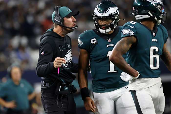 Philadelphia Eagles coach Nick Sirianni talks to quarterback Jalen Hurts